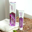 A package of Yunnan Baiyao JinKouJian Fresh Mint Toothpaste and a tube on the white towel.