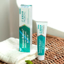A package of Yunnan Baiyao JinKouJian Refreshing Lime Toothpaste and a tube on the white towel.