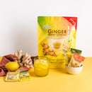 A glass of Ginger Honey Crystal Assorted cold drink with sachets and ginger around.