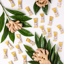 Pieces of Prince of Peace Ginger Chews Plus+, Original with gingers and leaves on a white background.