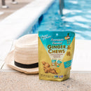 A package of Prince of Peace Ginger Candy (Chews) Pineapple Coconut with a hat aside on the siae of a pool.