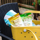 Package of Prince of Peace Ginger Chews Plus+, Original and lemon in a tote bag on a chair.