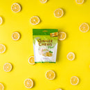 A package of Prince of Peace Ginger Chews Plus+, Lemon, 3oz with lemons slices on a yellow background.