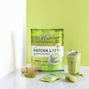 A glass of cold Prince of Peace 3-in-1 Instant Matcha Latte with biscuits and matcha powders. on a table.