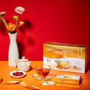 Prince of Peace Wild American Ginseng Instant Tea box and sachet with a cup of tea and a tea pot on the table.