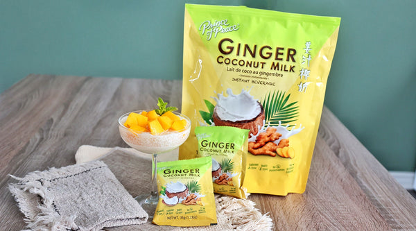 A glass of Ginger Coconut Mango Sago dessert with Prince of Peace Ginger Coconut Instant Beverage packages.