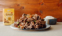 A plate of Korean ginger honey beef bulgogi and rice with a box of Prince of Peace Ginger Honey Crystals.