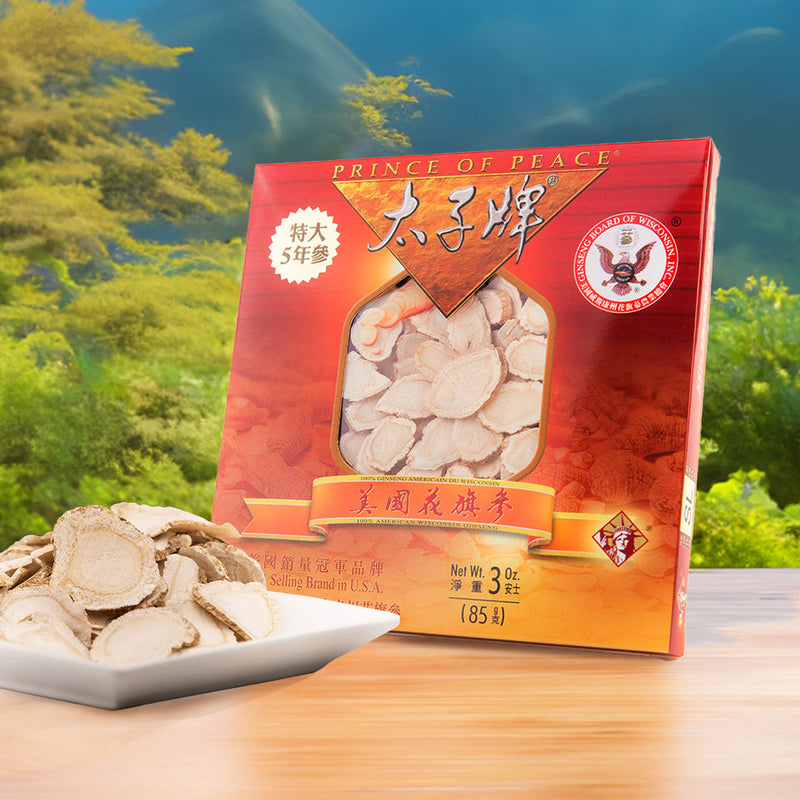 a box of 5 year jumbo wisconsin american ginseng slices with a plate of ginseng slices in the front and forest and mountains in the background.