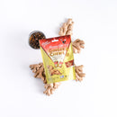 A package of Ginger Chews Cola surrounded by ginger root and a cup of iced Cola on a white background.