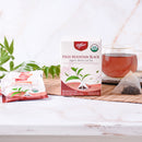 Prince of Peace High Mountain Black Organic Whole Leaf Tea with a tea bag and a cup of tea aside.