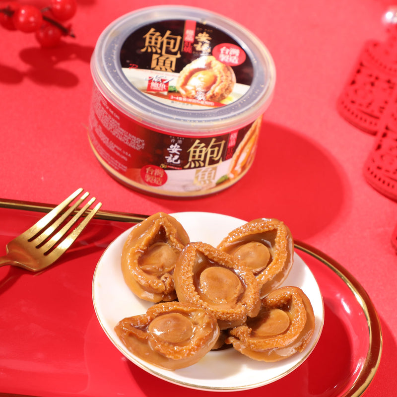 On Kee Braised Abalones on a plate with a package on a red background.