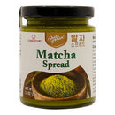 A jar of Prince of Peace Matcha Spread, featuring a black lid and a cream-colored label with green text and an illustration of matcha powder in a wooden bowl. The brand 'Cookstar' is also visible on the label.