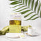 Prince of Peace Organic Green Tea in a mug with a package on a white countertop.