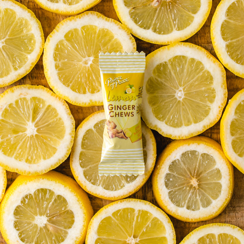A piece of Prince of Peace Ginger Candy (Chews) with Lemon in front of some lemon slices.