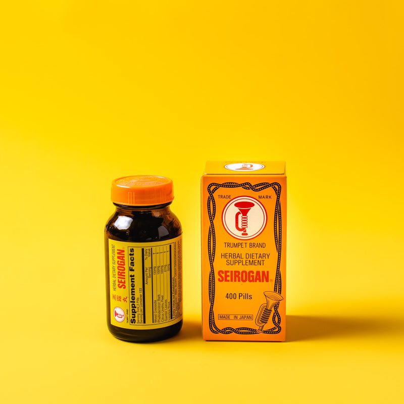 Trumpet Brand Seirogan Herbal Stomach Supplement, 400 pills in a yellow background.