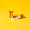 A box and a bottle Trumpet Brand Seirogan TOI-A with some pills aside on 
 yellow background. 