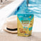 A package of Prince of Peace Ginger Candy (Chews) Pineapple Coconut with a hat aside on the siae of a pool.