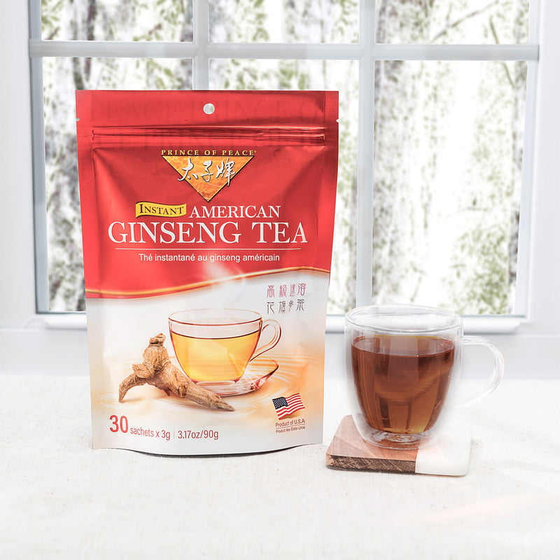 Prince of Peace American Ginseng Instant Tea with a cup of tea on a table.