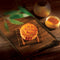 A Wing Wah 2 Yolks White Lotus Seed Paste Mooncake with a cup of tea