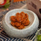On Kee abalnoes in a ceramic plate on a tablecloth.