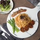 On Kee Abalone with noodle, lettuce and asparagus on a white plate.