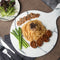 On Kee Abalone with noodle, lettuce and asparagus on a white plate.